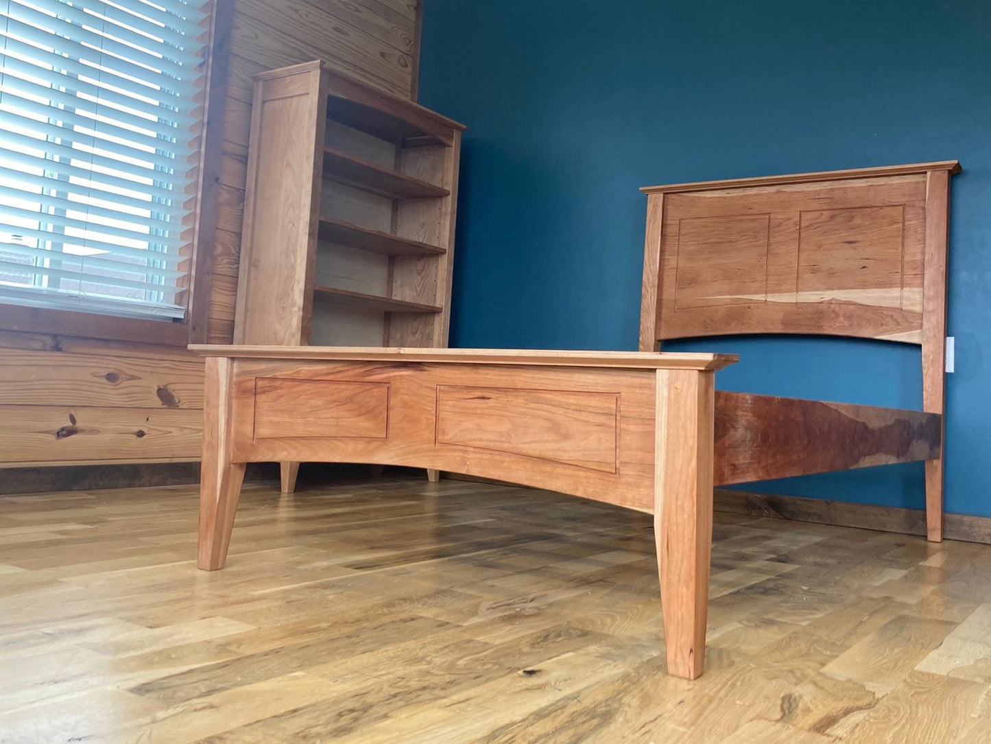 Solid Cherry Shaker Style Bed frame with slats. It has a headboard and footboard and solid wood sides.