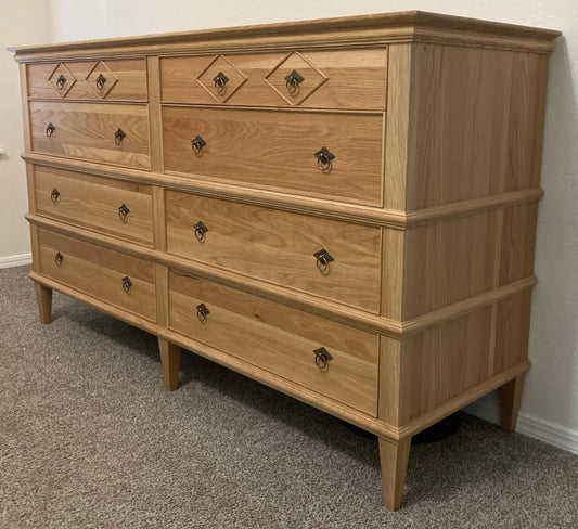 Handcrafted solid oak dresser with 8 drawers.  Made of solid wood using traditional joinery.