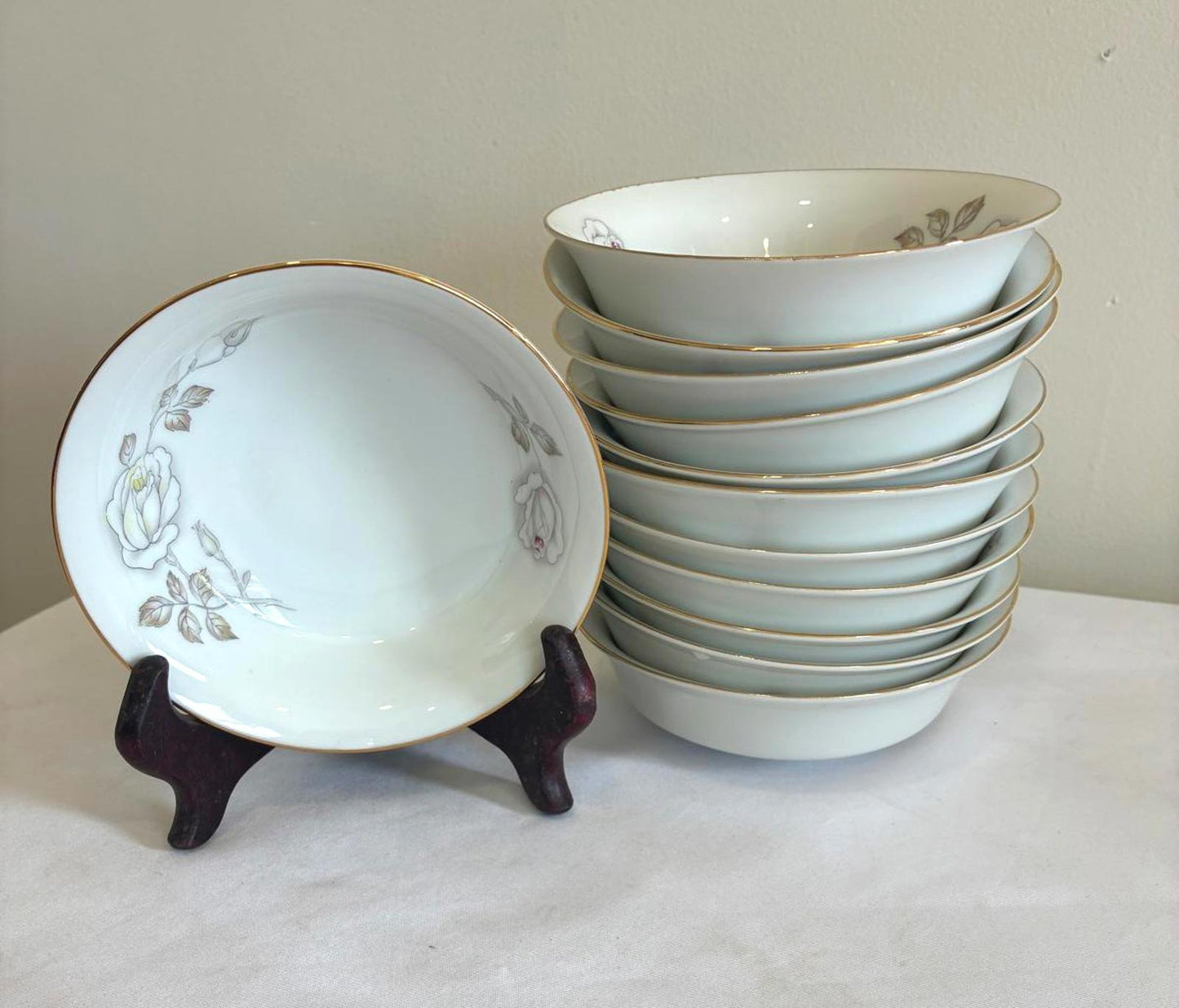 Set of ceramic bowls with floral design on a white surface