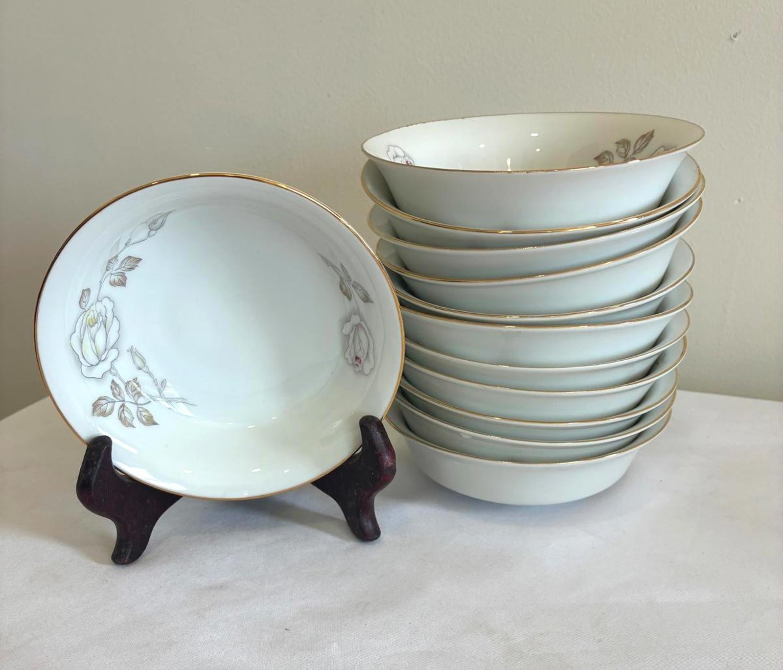 Set of ceramic bowls with floral design on a white surface