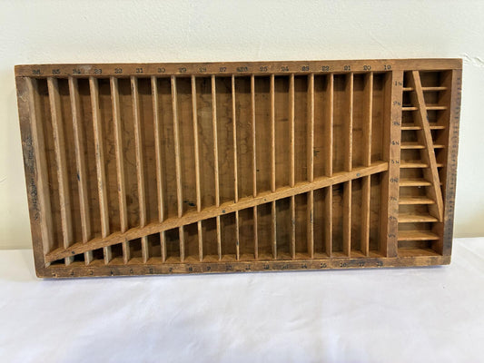 Antique Hamilton Manufacturing Company wooden printer's type case with divided compartments and original numbering used for letterpress printing.