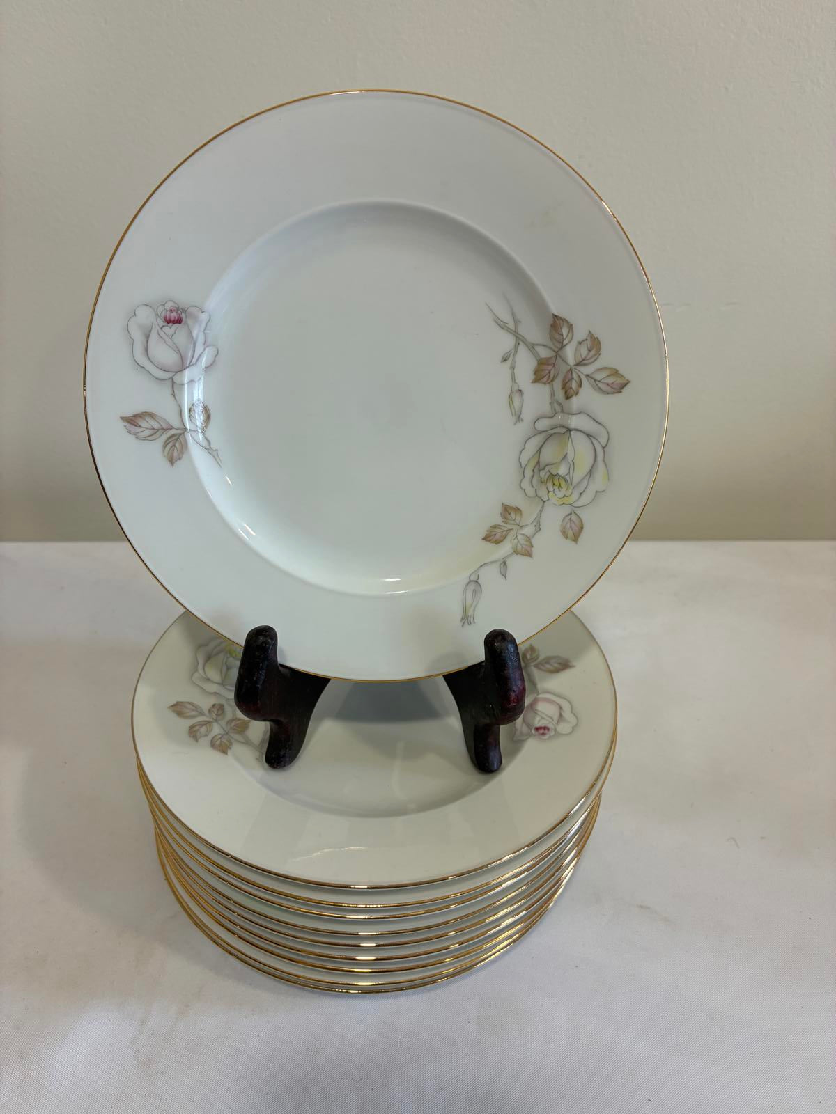 Set of decorative plates by Johann Haviland with floral patterns on a white background