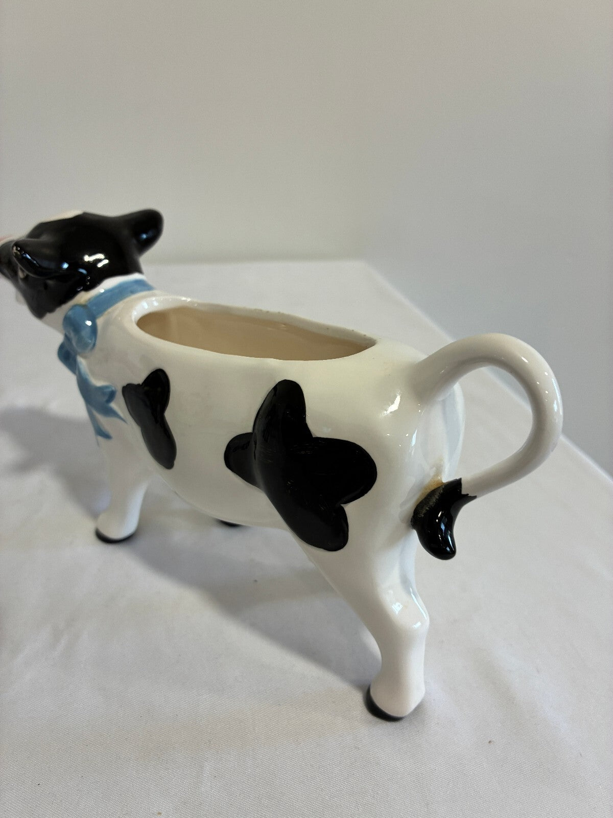 Vintage Ceramic Cow Creamer, Black and White Holstein Cow Pitcher with Blue Bow