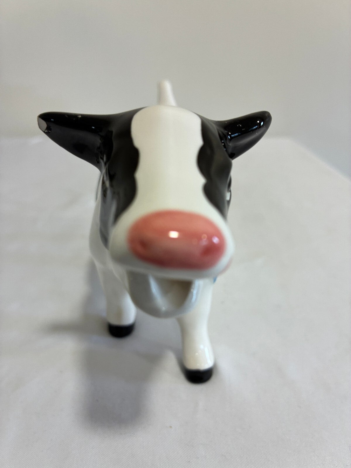 Vintage Ceramic Cow Creamer, Black and White Holstein Cow Pitcher with Blue Bow