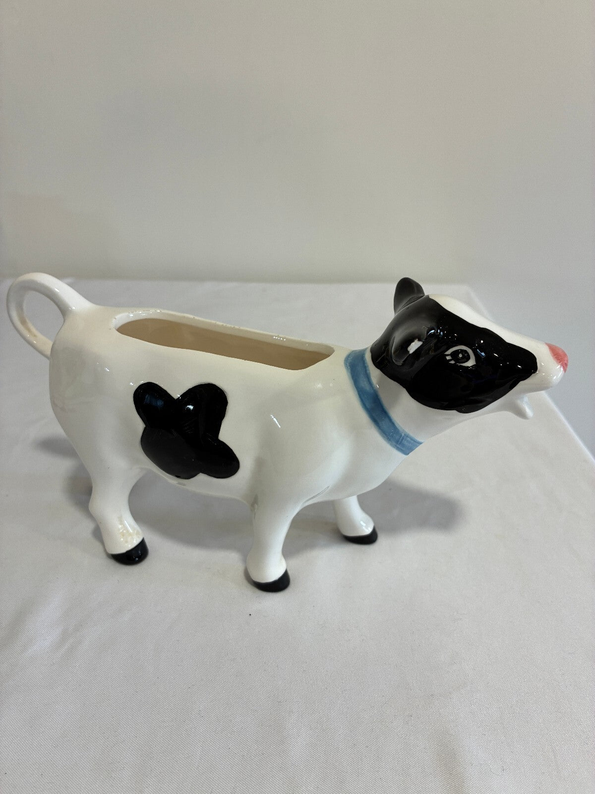 Vintage Ceramic Cow Creamer, Black and White Holstein Cow Pitcher with Blue Bow