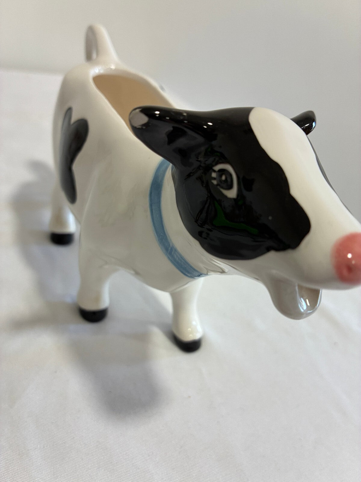 Vintage Ceramic Cow Creamer, Black and White Holstein Cow Pitcher with Blue Bow