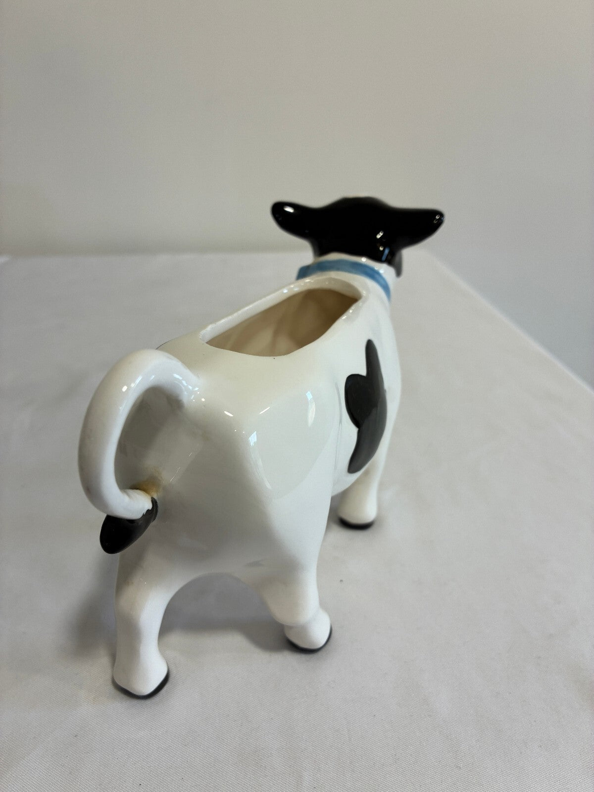 Vintage Ceramic Cow Creamer, Black and White Holstein Cow Pitcher with Blue Bow
