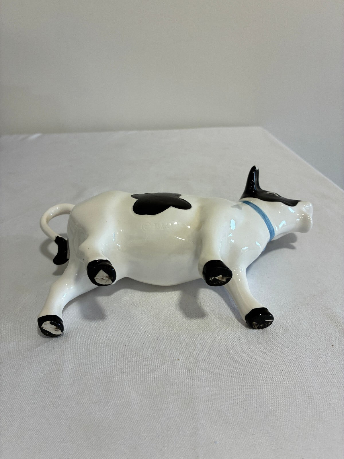 Vintage Ceramic Cow Creamer, Black and White Holstein Cow Pitcher with Blue Bow