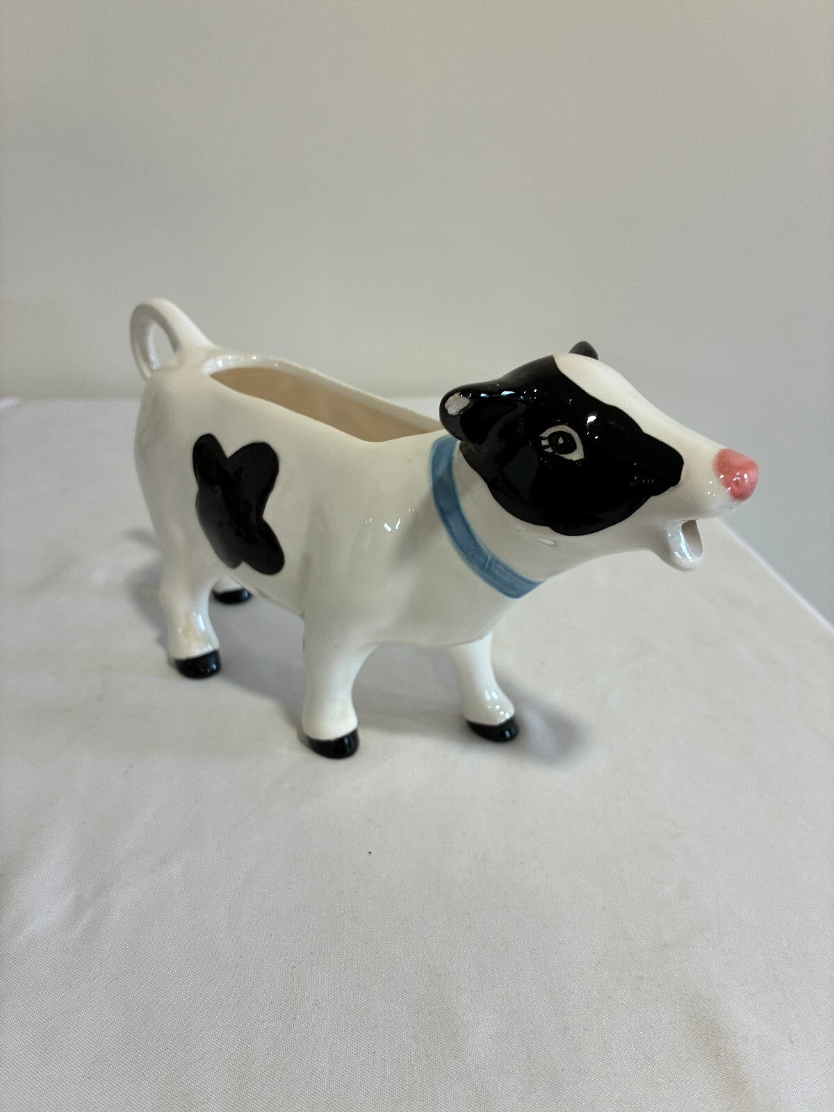 Vintage Ceramic Cow Creamer, Black and White Holstein Cow Pitcher with Blue Bow