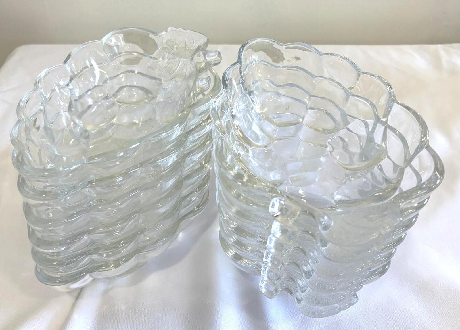 Set of clear glass bowls with textured graphe design on a white surface