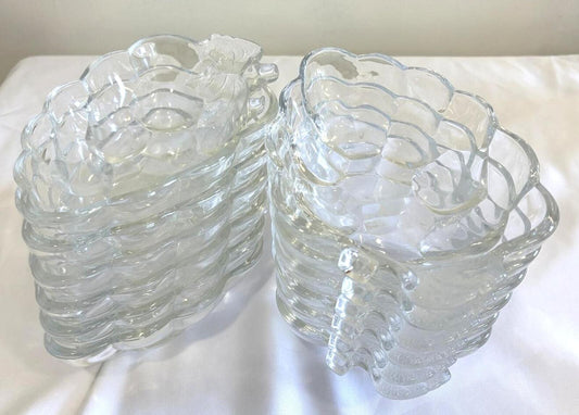 Set of clear glass bowls with textured graphe design on a white surface