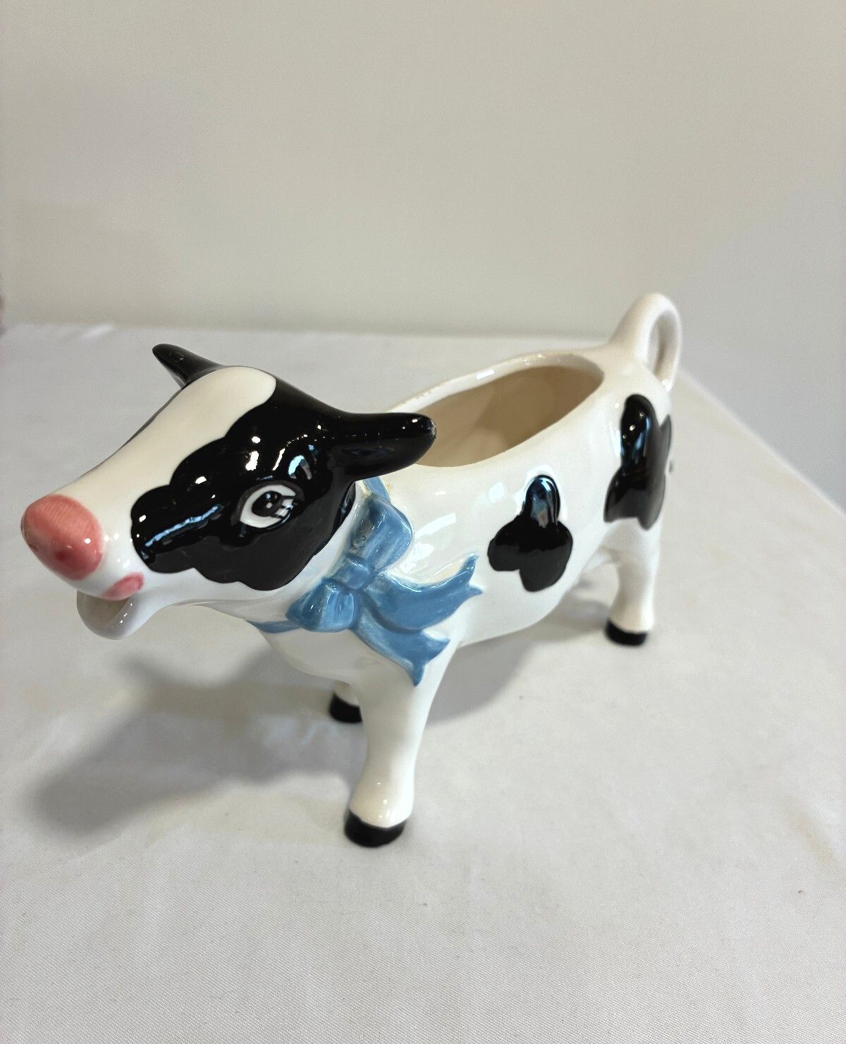 Vintage Ceramic Cow Creamer, Black and White Holstein Cow Pitcher with Blue Bow